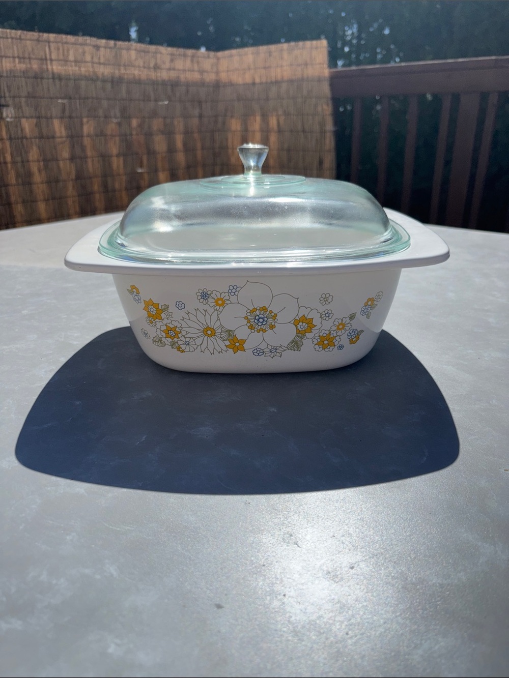 White Ceramic Casserole Dish with Yellow Floral Pattern and Glass Lid
